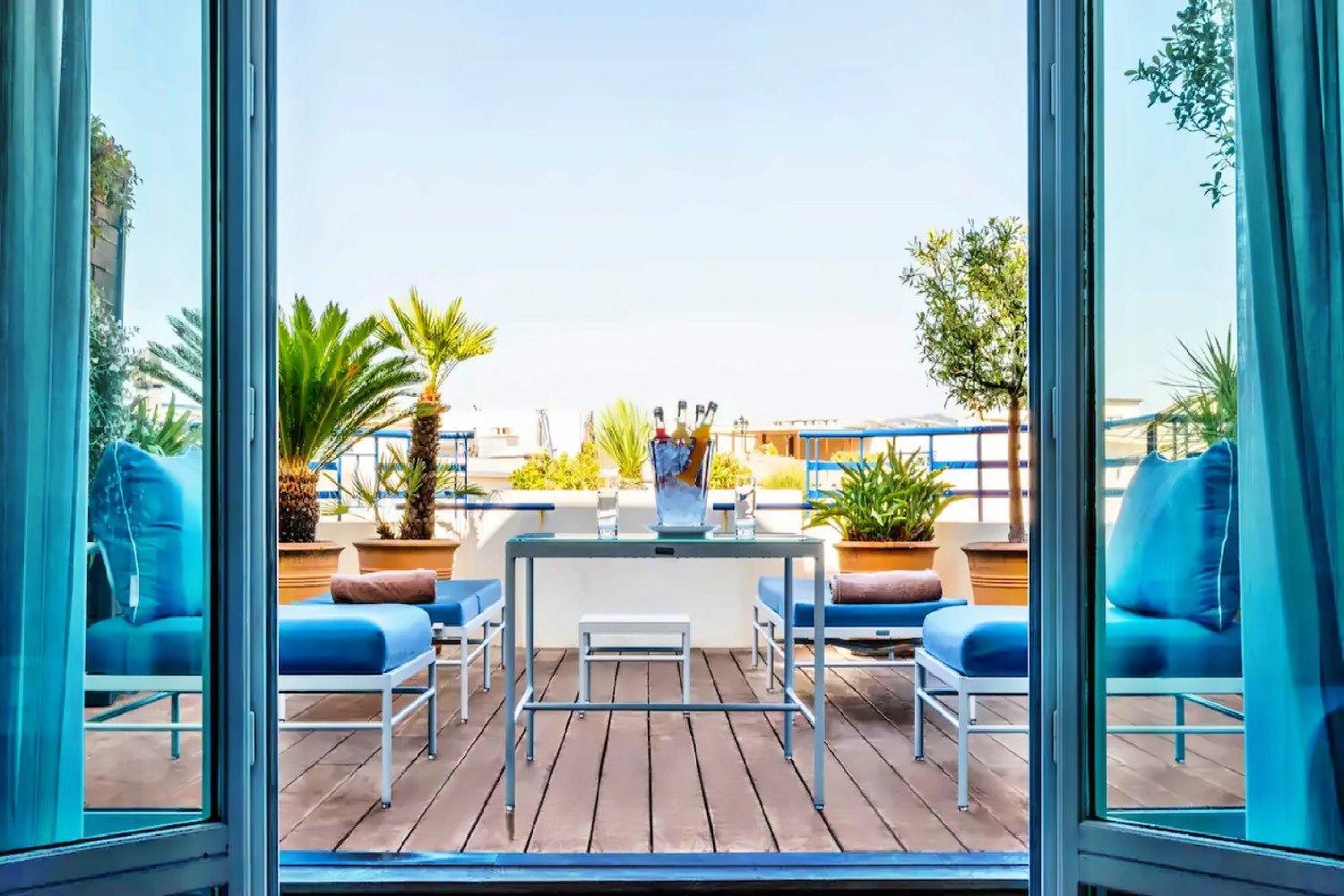 Junior Terrace Suite at Hotel Martinez Cannes with a private terrace and Riviera light