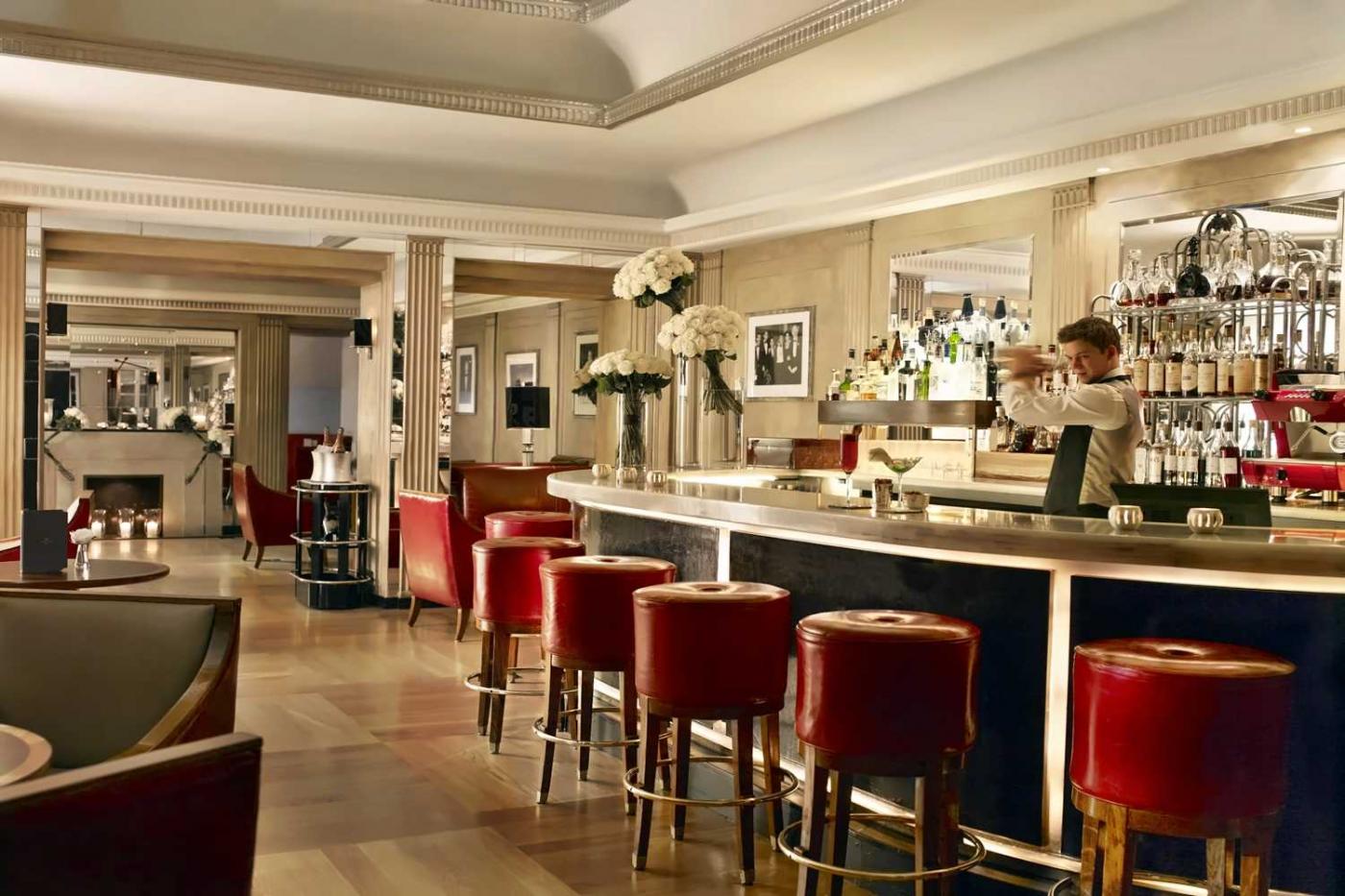 Claridge's Bar in London with polished counter red stools and Art Deco Mayfair atmosphere