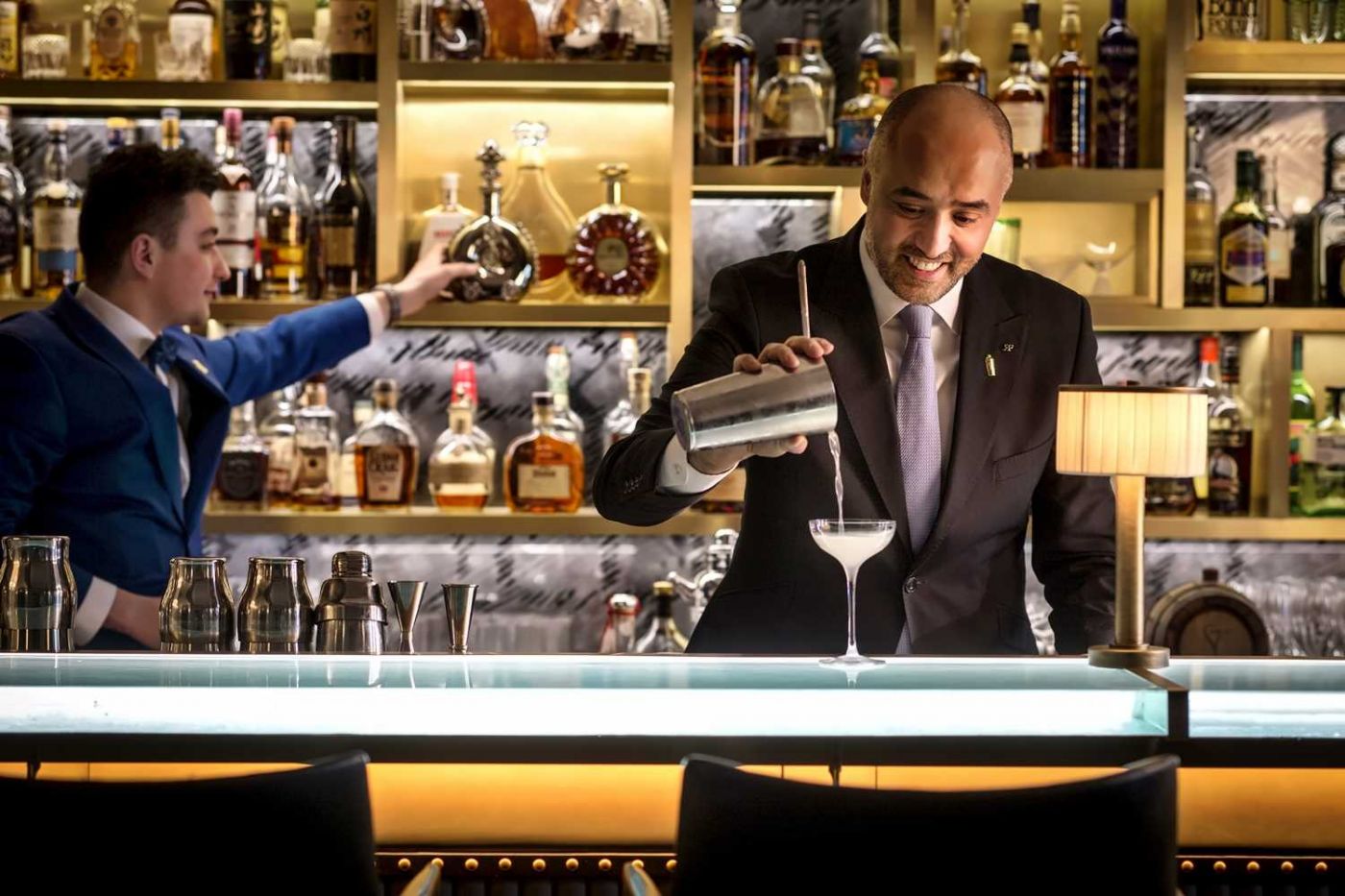Donovan Bar at Brown's Hotel London with bartenders and Mayfair cocktail-bar counter