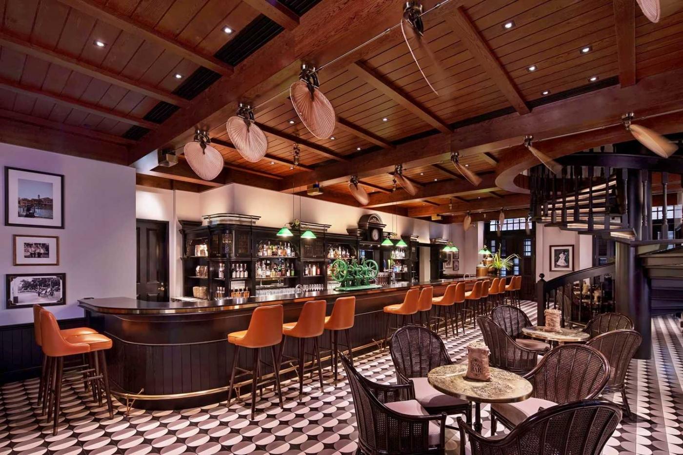 Long Bar at Raffles Singapore with tropical colonial-style cocktail bar interior
