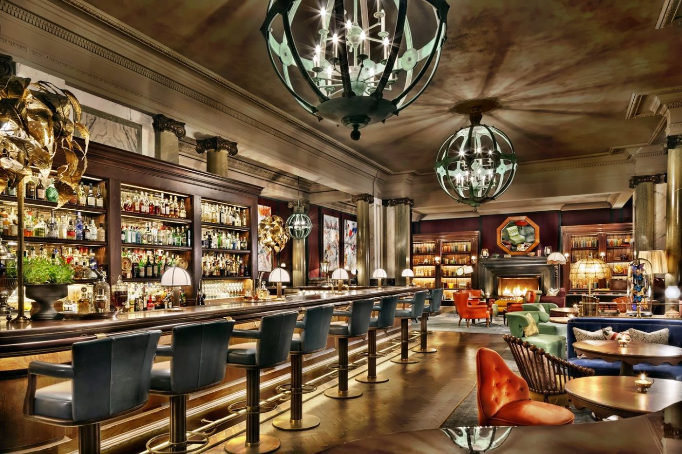 Scarfes Bar at Rosewood London with bookshelves artwork and warm club-like seating