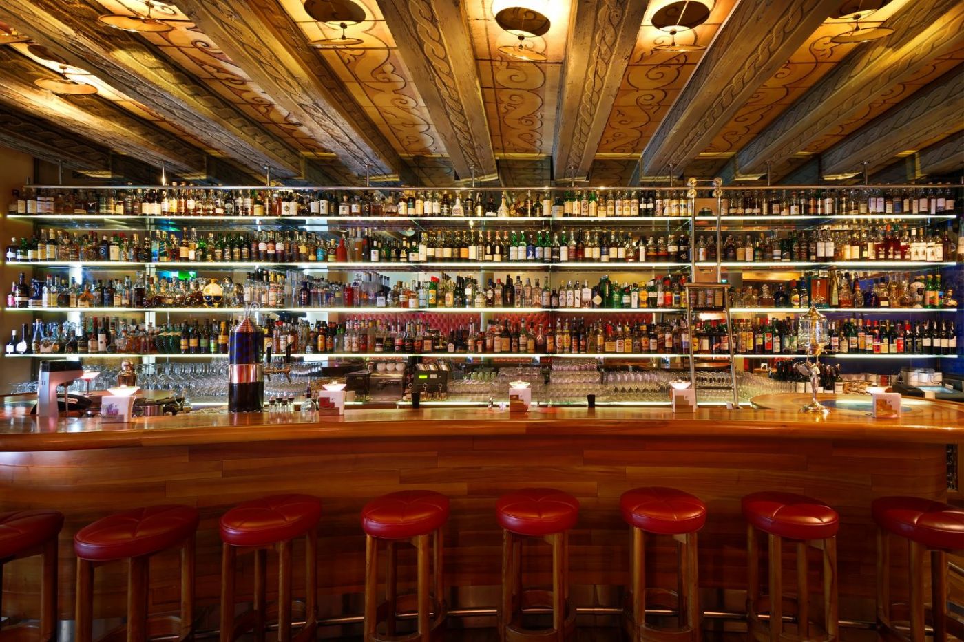 Widder Bar Zurich with extensive spirit shelves and historic-beam cocktail-bar interior