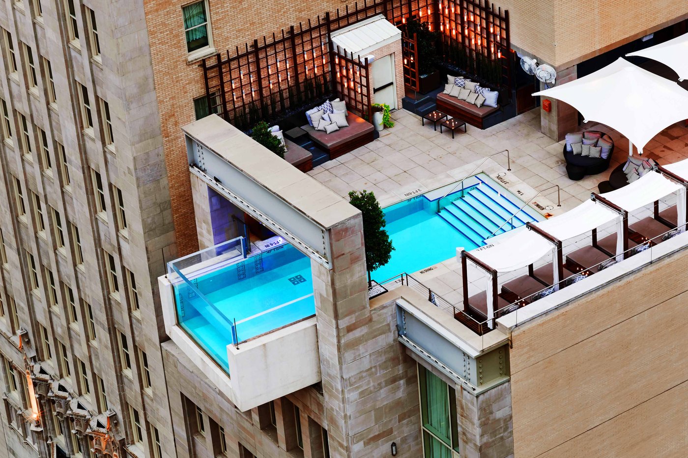 The Joule Dallas cantilevered rooftop pool projecting over the building edge