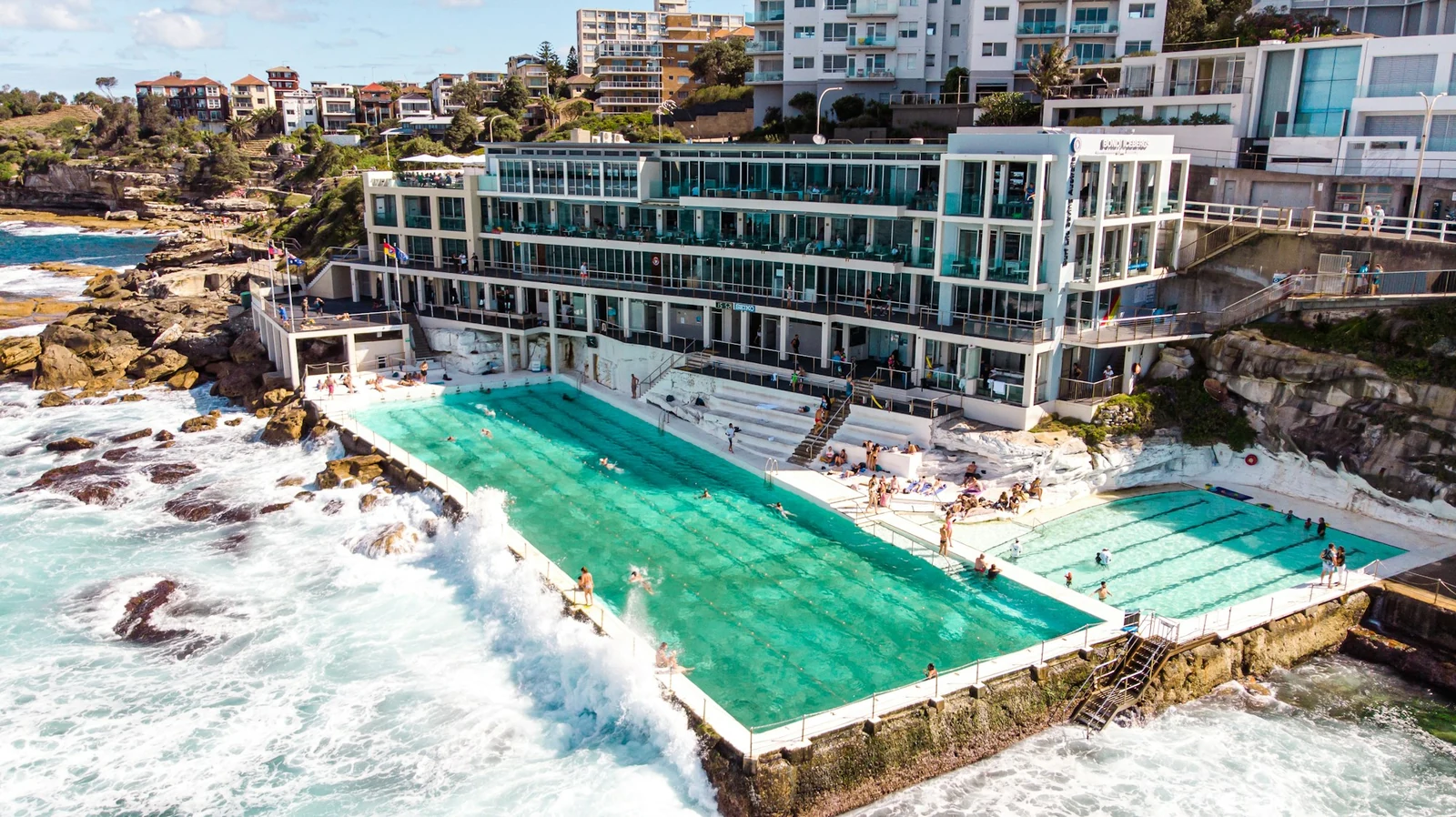 Aerial view of Bondi Icebergs pools beside the breaking ocean waves