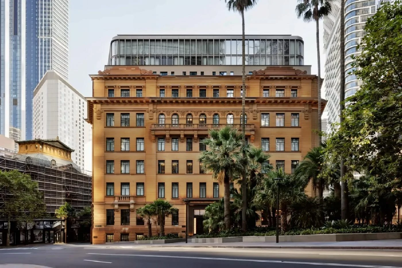 The sandstone exterior of Capella Sydney in the former Department of Education building