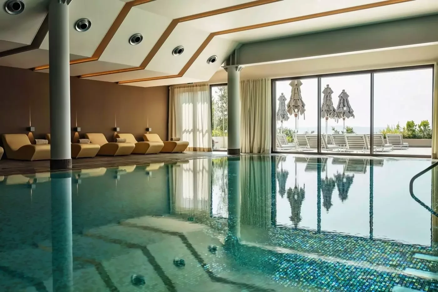 Indoor pool at Castelfalfi beside large windows facing the countryside