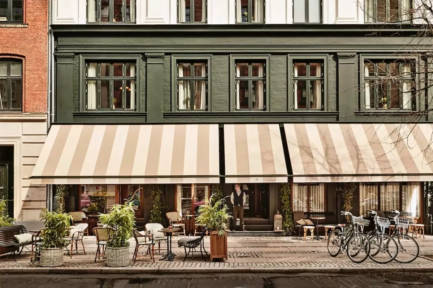 Hotel Sanders facade and outdoor tables on Tordenskjoldsgade in Copenhagen