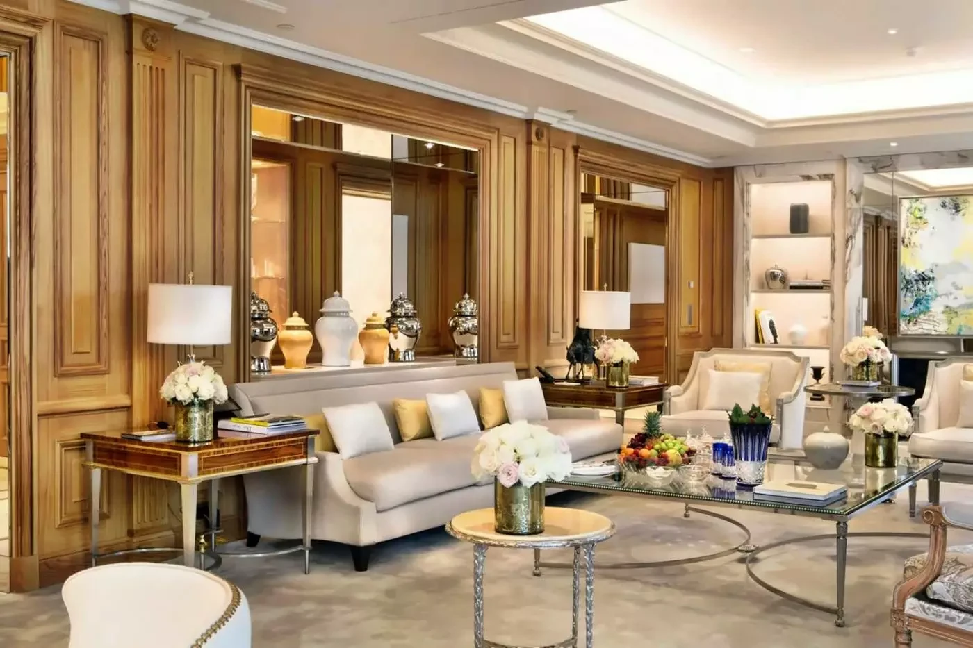 Elegant sitting room with timber paneling at Four Seasons Hotel George V in Paris