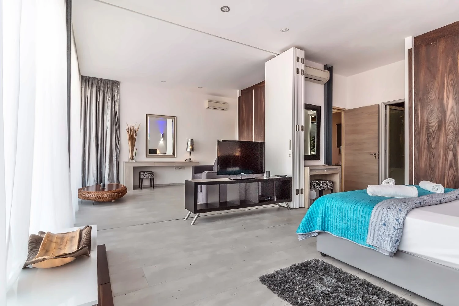 Prepared hotel suite with separate sitting and sleeping spaces