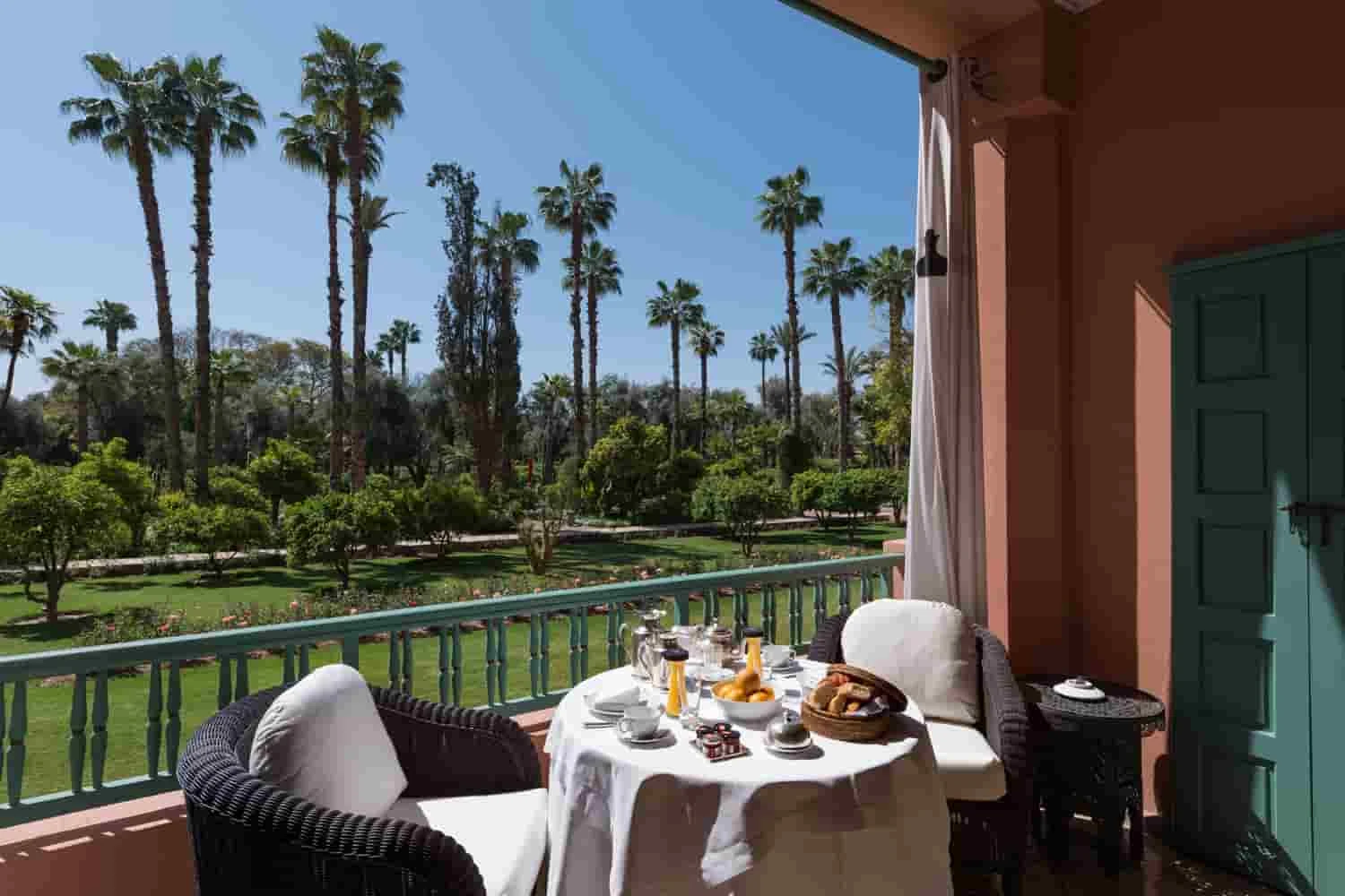 La Mamounia room terrace overlooking the palm-filled gardens