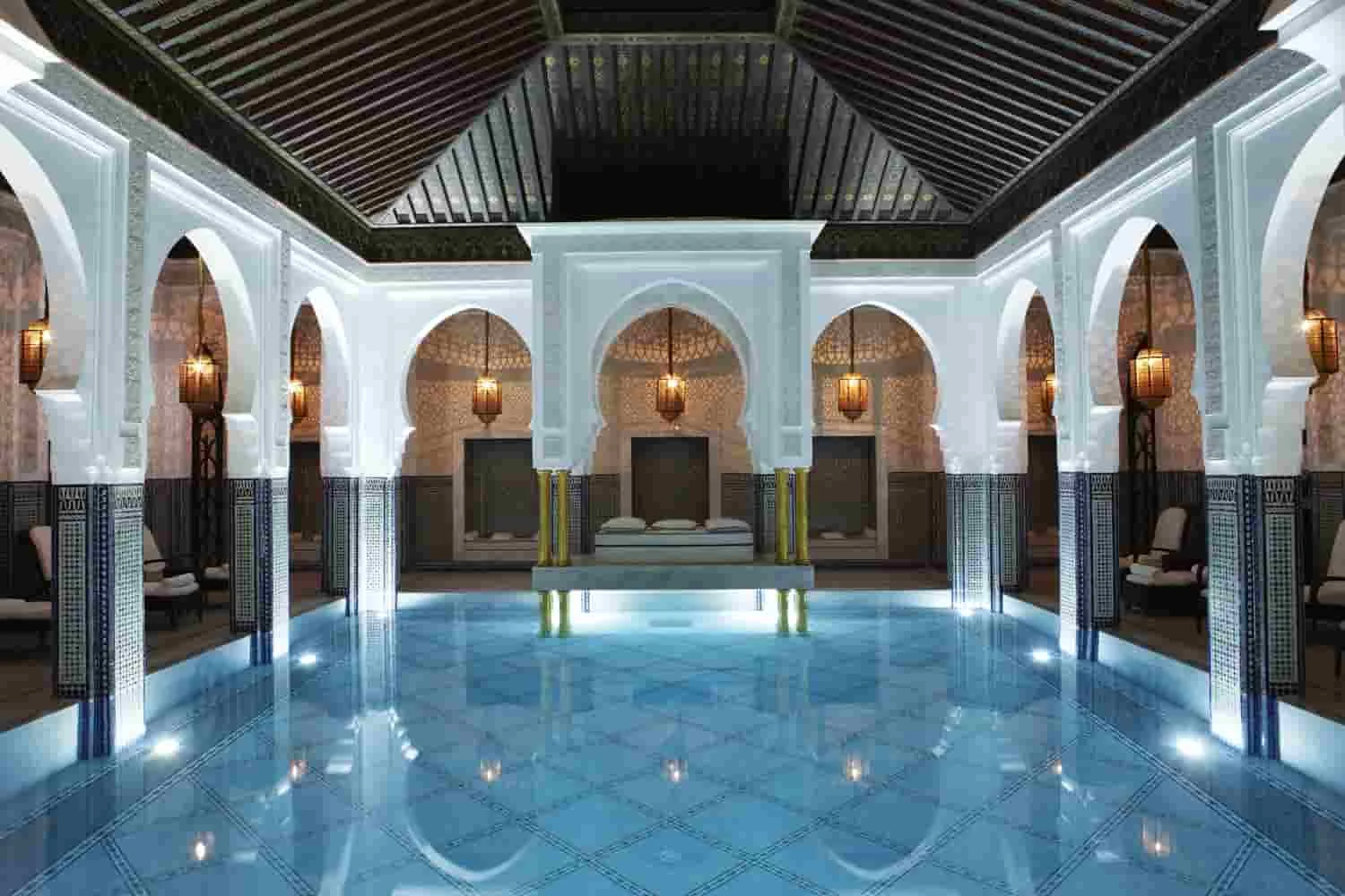 Indoor pool framed by arches at La Mamounia