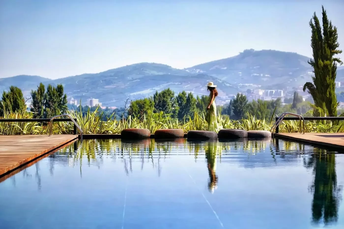 Outdoor swimming pool overlooking the Douro Valley hills at Six Senses